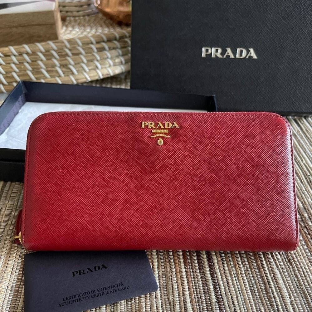 Prada red saffiano leather zip around wallet